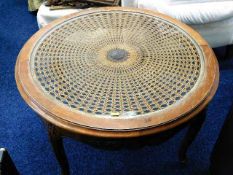 An attractive carved circular coffee table with gl