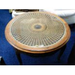 An attractive carved circular coffee table with gl