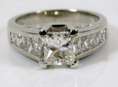 A fine platinum diamond ring set with centre stone