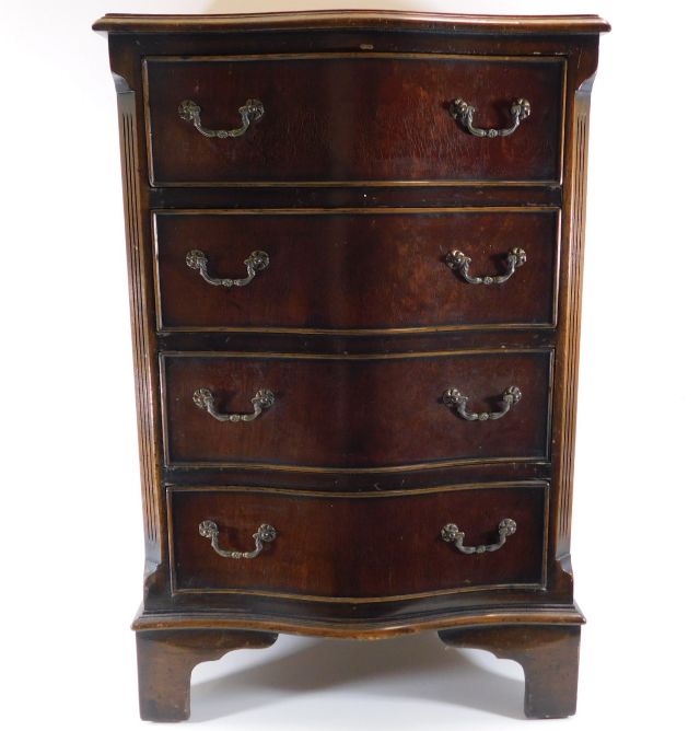 A mahogany serpentine chest of four drawers