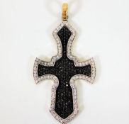 An 18ct gold Gothic style cross set with black & w