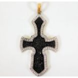 An 18ct gold Gothic style cross set with black & w