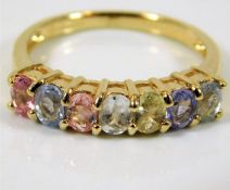 A 9ct gold ring set with rainbow colour sapphires