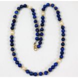 An early 20thC. lapis lazuli necklace set with pea