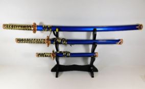 A mounted set of three Samurai swords