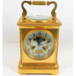 A large J. Wilkinson brass carriage clock with com