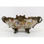 A French bronze mounted Limoge style porcelain bow