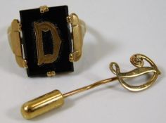 A 9ct gold ring with letter D sie M twinned with a