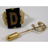 A 9ct gold ring with letter D sie M twinned with a