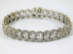 A white metal bracelet set with 3ct diamond & test