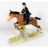 A Beswick figure of woman riding side saddle over