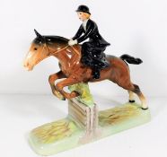 A Beswick figure of woman riding side saddle over