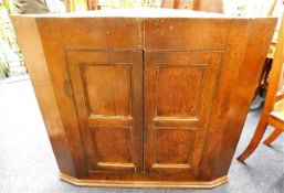 A 19thC. oak corner cupboard. Provenance: From Tre