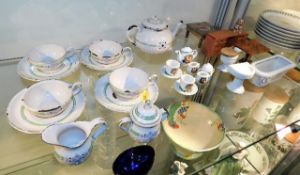 An enamel childs doll tea set twinned with a ceram