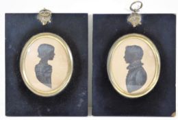 A pair of early 19thC. silhouettes by Amos Clitherall depicting J & E. Marquison dated 1826