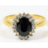 An 18ct gold diamond & sapphire ring 5g size S