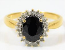 An 18ct gold diamond & sapphire ring 5g size S