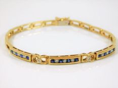 A 9ct gold bracelet set with 0.4ct diamond & sapph