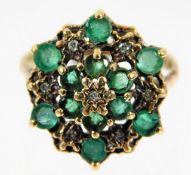 A 9ct gold ring set with green & white stones 2.8g