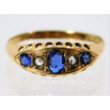 An antique 18ct gold ring set with diamond & sapph
