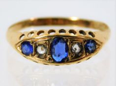 An antique 18ct gold ring set with diamond & sapph