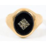 A 9ct gold ring with small diamond set in onyx 3.8