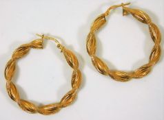 A pair of 9ct gold twist earrings 3.5g, 1.5in diam