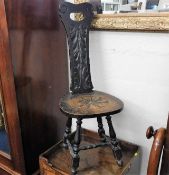 A c.1900 carved oak spinning chair