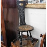 A c.1900 carved oak spinning chair