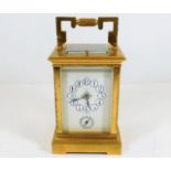A brass J. Sewill carriage clock with enamelled dial 7.75in high, not running
