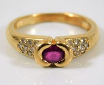 An 18ct gold ring set with ruby & diamond 3.9g siz