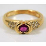 An 18ct gold ring set with ruby & diamond 3.9g siz