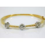 An 18ct gold bangle set with approx. 1ct diamond 2