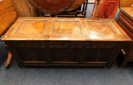 A 17thC. oak coffer with carved decor W50in wide x