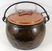 An 18thC. copper cauldron 19in wide. Provenance: F