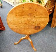 A Georgian oak birdcage tilt top table