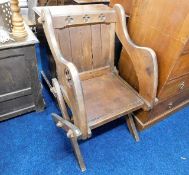 A stained pine Glastonbury chair