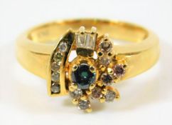 A yellow metal ring set with blue centre diamond &