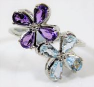 A 9ct white gold ring set with amethyst & topaz 2.