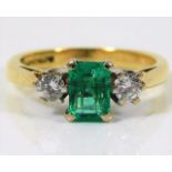 An 18ct gold ring set with emerald & approx. 0.3ct