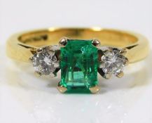 An 18ct gold ring set with emerald & approx. 0.3ct