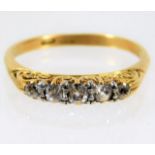 An antique 18ct gold ring set with five diamonds o