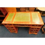 A yew wood style pedestal desk. Provenance: From T