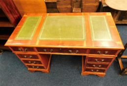 A yew wood style pedestal desk. Provenance: From T