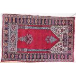 An Islamic prayer rug 60in x 39in