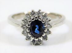 A 14ct white gold ring set with sapphire & approx.