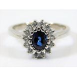 A 14ct white gold ring set with sapphire & approx.