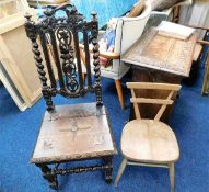 An elm childs chair twinned with an antique carved