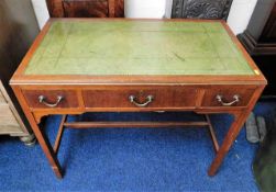 A small mahogany writing desk with three drawers