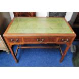 A small mahogany writing desk with three drawers